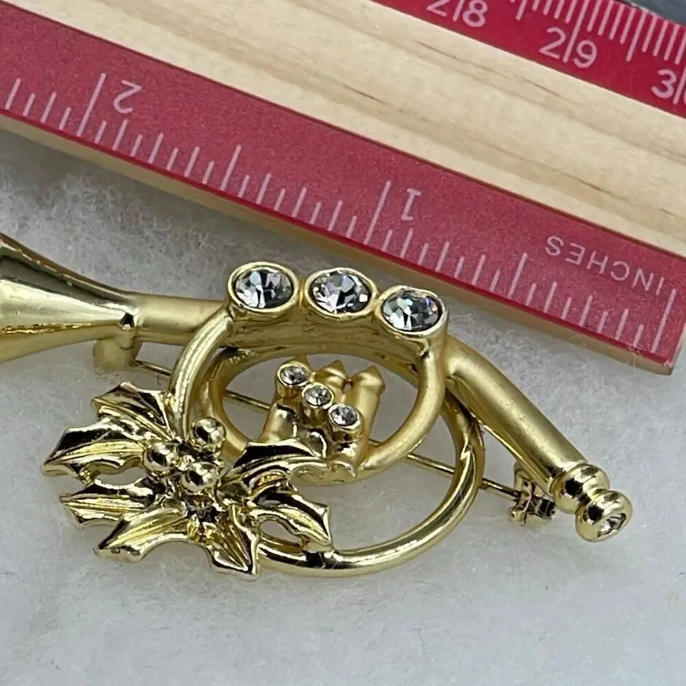 Vintage AGC matte and shiny embellished French Horn brooch.